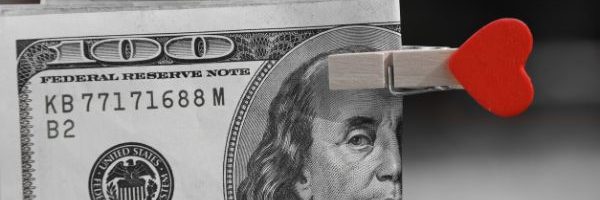 100 dollar bill with heart shaped clip
