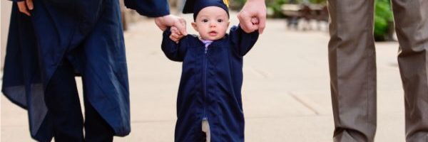 baby in cap and gown