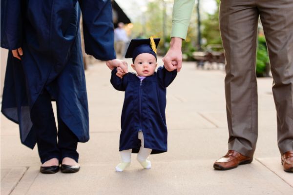 baby in cap and gown